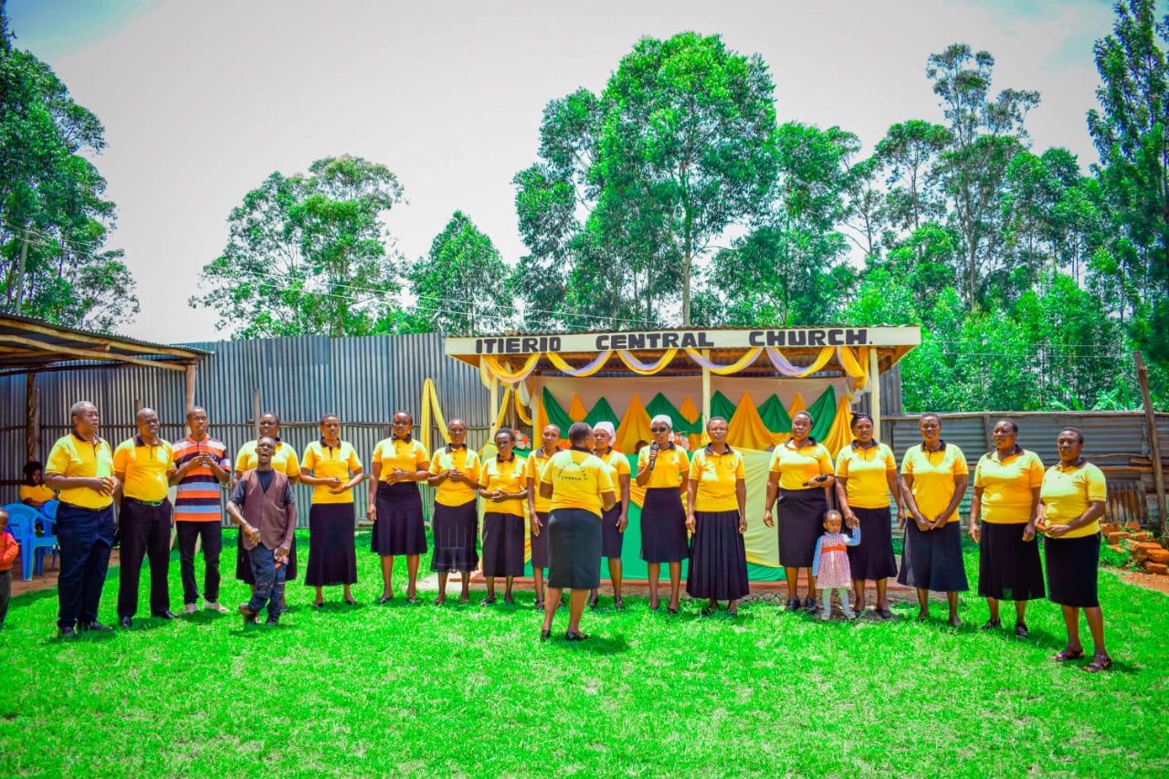 Choir members singing outside Itierio Central Church